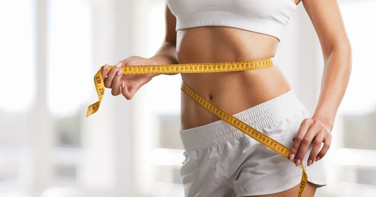 Toned abdomen with measuring tape for Weight Loss in Salt Lake City, UT